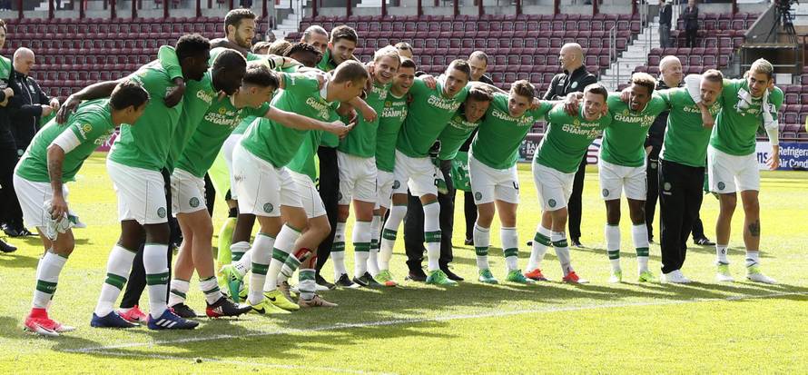 Celtic players celebrate winning the Scottish Premiership