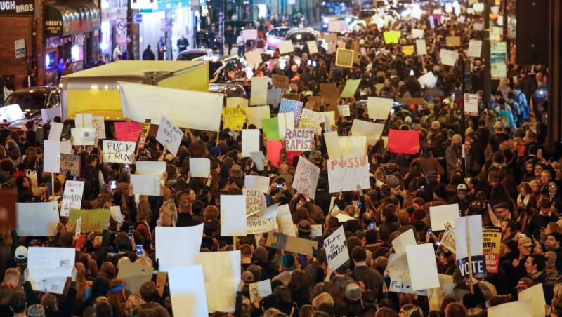 Protesters walk against Republican president-elect Donald Trump in Chicago