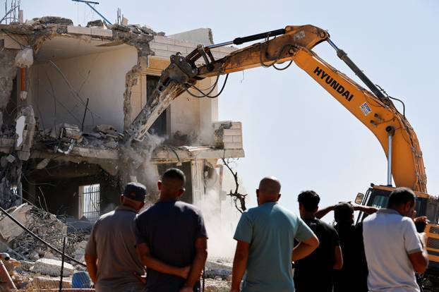 Israeli heavy machinery demolition of a Palestinian building near Hebron