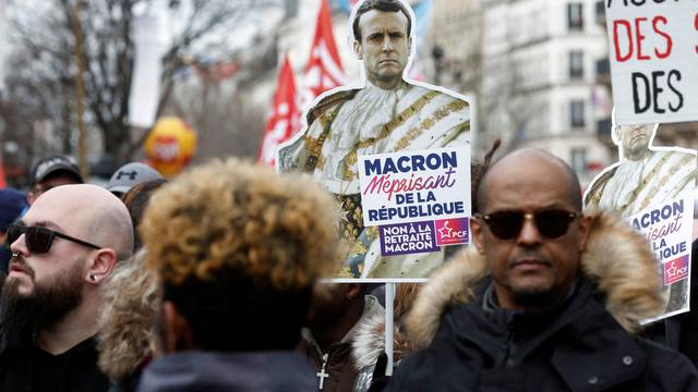 FILE PHOTO: French unions and workers march against pension reforms in Paris