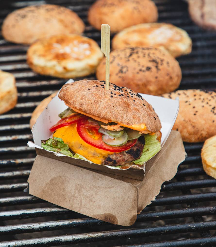 Chef frying burgers on the grill