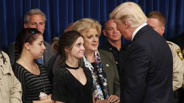 U.S. President Trump is greeted by family members after meeting with police in Las Vegas, Nevada
