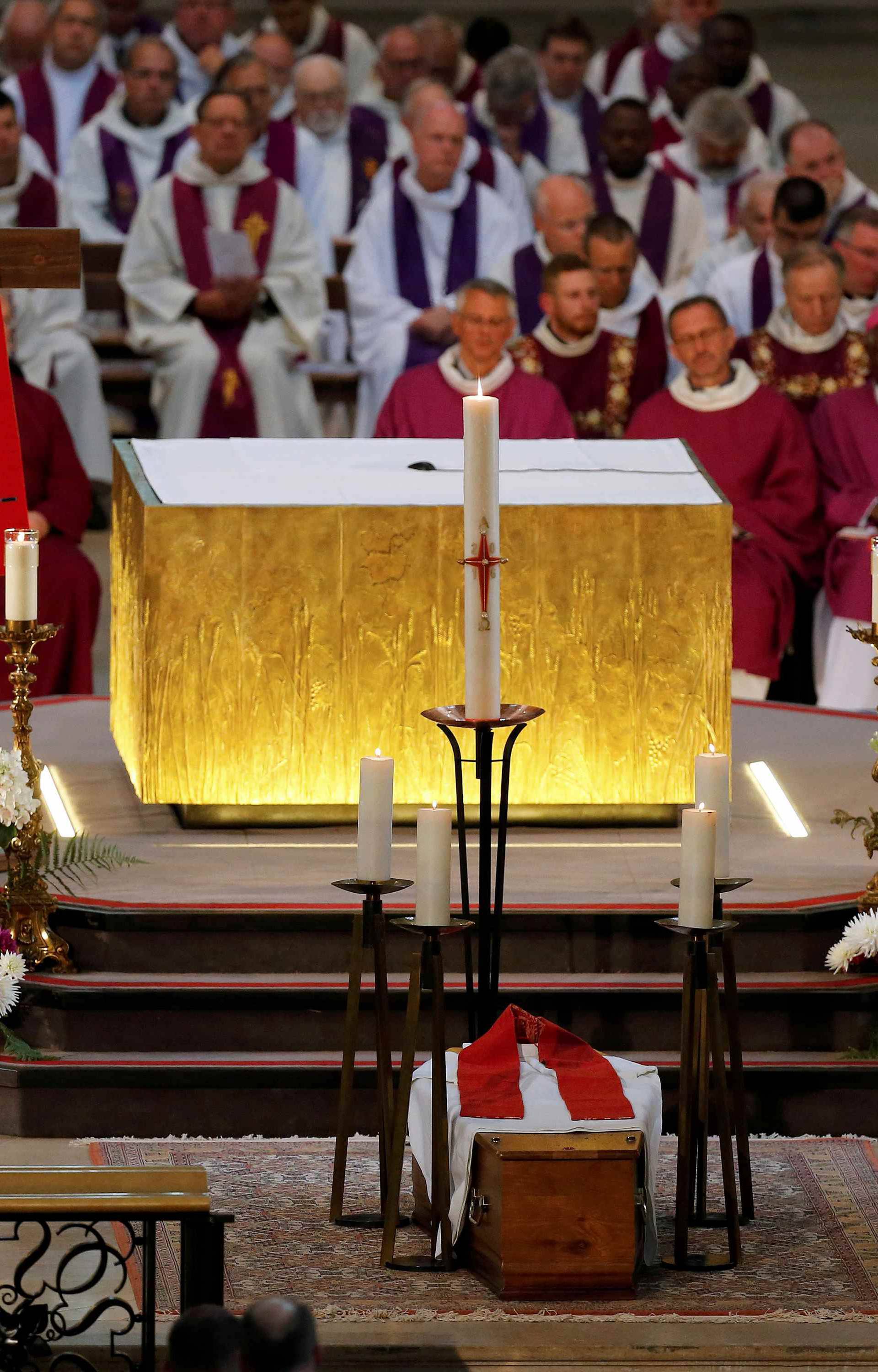 People attend a funeral service to slain French parish priest Father Jacques Hamel at the Cathedral in Rouen