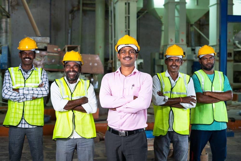 Industrial,Employees,With,Crossed,Arms,Standing,By,Looking,Camera,At