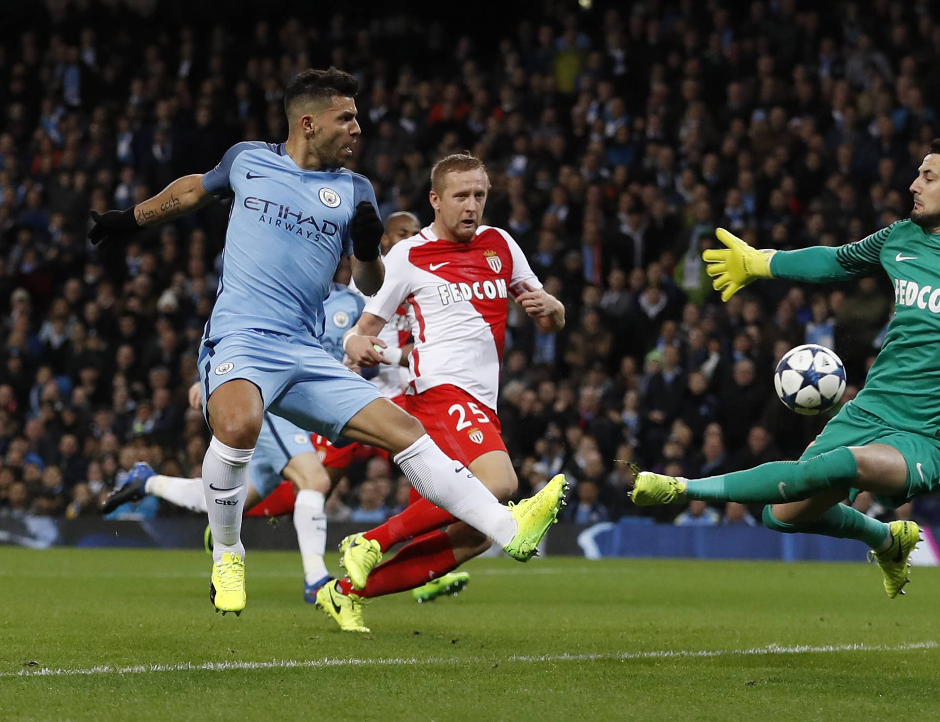 Manchester City's Sergio Aguero in action with Monaco's Danijel Subasic