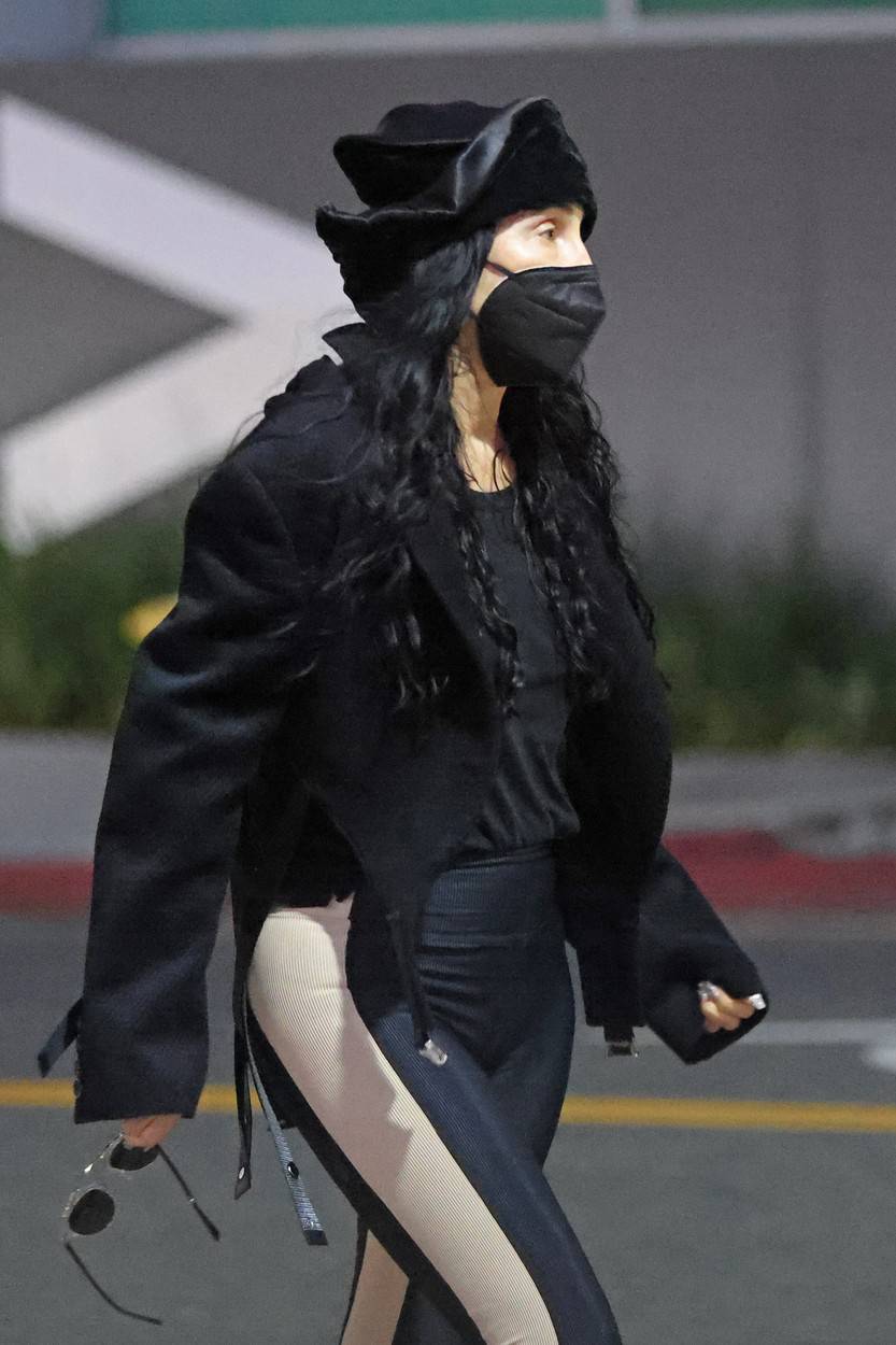 Music superstar Cher shows how sheŐs turning back time at 75 whilst running errands in Beverly Hills looking chic and fashionable.