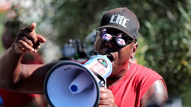 Protesters gather at the El Cajon Police Department headquarters to protest fatal shooting of an unarmed black man Tuesday by officers in El Cajon, California