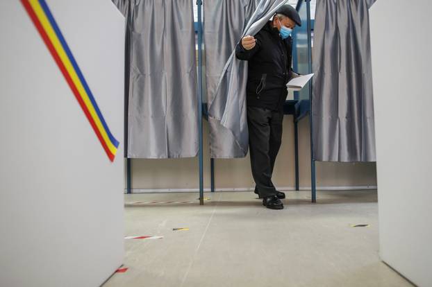A man casts his ballot in Romania