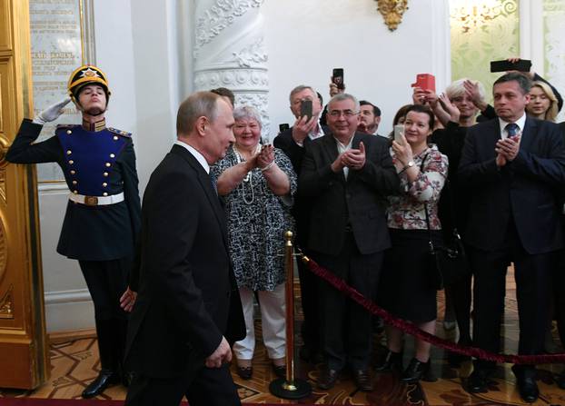 Russian President Putin walks before an inauguration ceremony at the Kremlin in Moscow