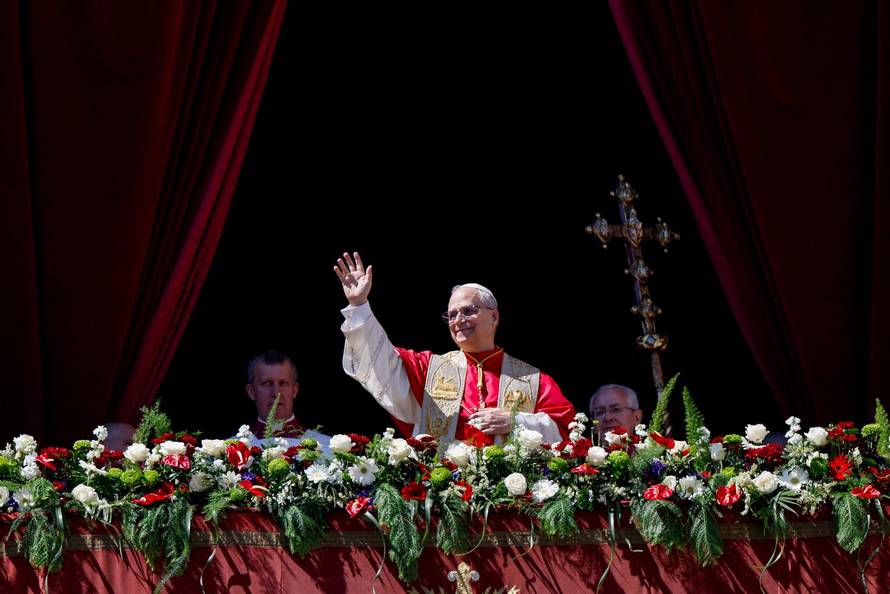 Pope Leo XIV delivers his "Urbi et Orbi" (To the city and the world) message from the main balcony of St. Peter's Basilica