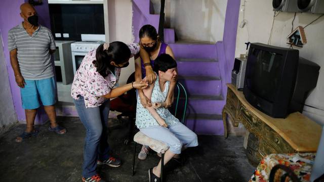 Venezuelan healthcare workers go from door to door to vaccinate residents against the coronavirus disease (COVID-19)
