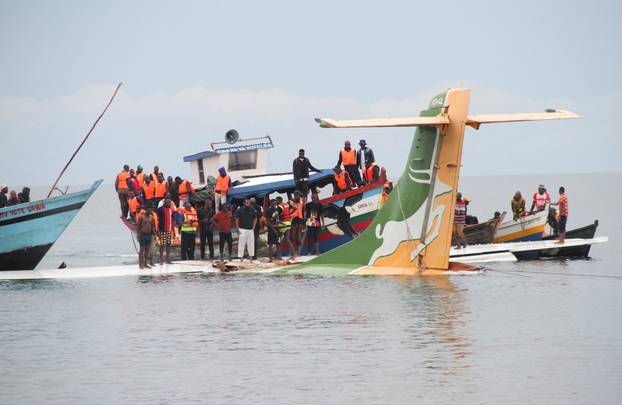 Rescuers attempt to recover the Precision Air passenger plane that crashed into Lake Victoria in Bukoba