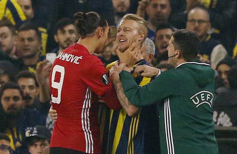 Manchester United's Zlatan Ibrahimovic clashes with Fenerbahce's Simon Kjaer