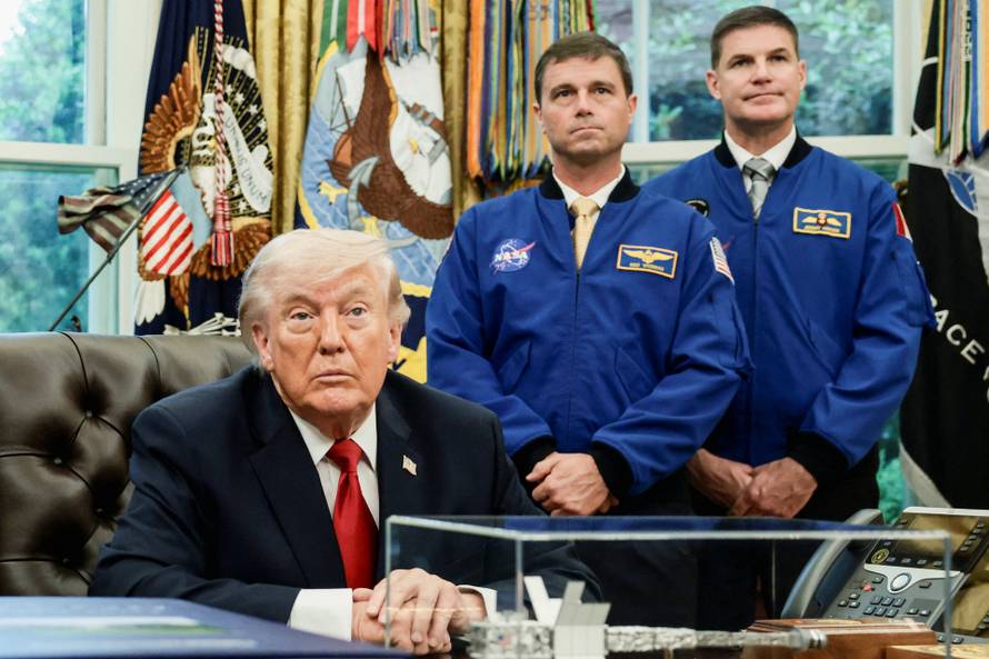 U.S. President Donald Trump meets Artemis II astronauts in the Oval Office at the White House in Washington