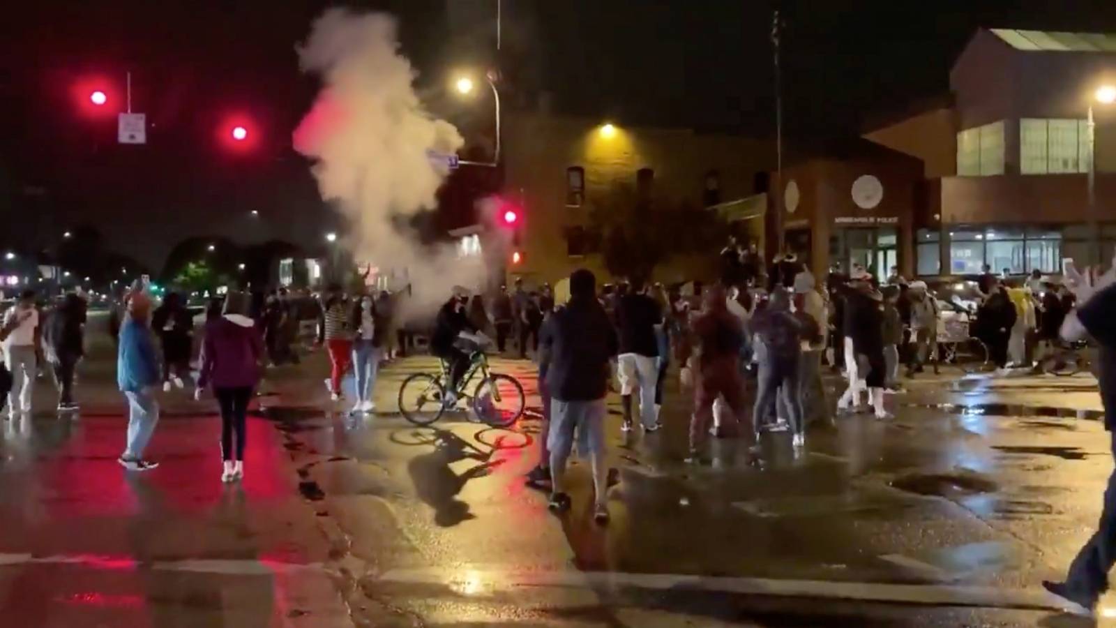 Still image shows police reportedly using tear gas and flash grenades against protesters demonstrating after the death of George Floyd in Minneapolis