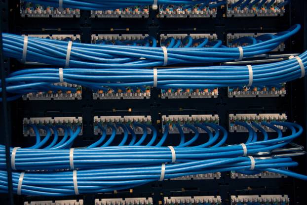 Close-up,Of,Organized,Blue,Network,Cables,In,A,Server,Rack.