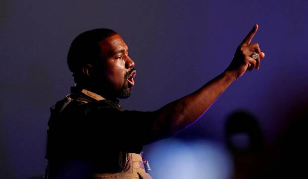 FILE PHOTO: Rapper Kanye West gestures to the crowd