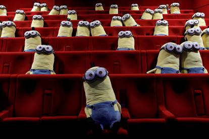 Minions toys are seen on cinema chairs to maintain social distancing between spectators at a MK2 cinema in Paris