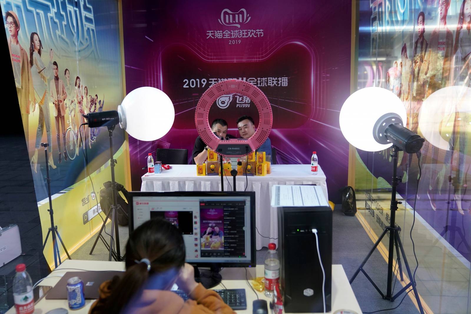 Two merchants perform in a live stream booth during Alibaba Group's 11.11 Singles' Day global shopping festival at the company's headquarters in Hangzhou