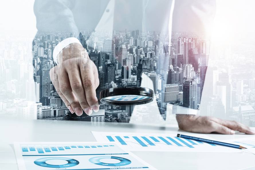 Man,Analyzing,Financial,Documents,With,Magnifying,Glass.,Financial,Expertise,And