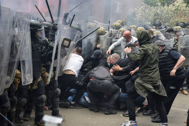 NATO Kosovo Force (KFOR) soldiers clash with local Kosovo Serb protesters in the town of Zvecan