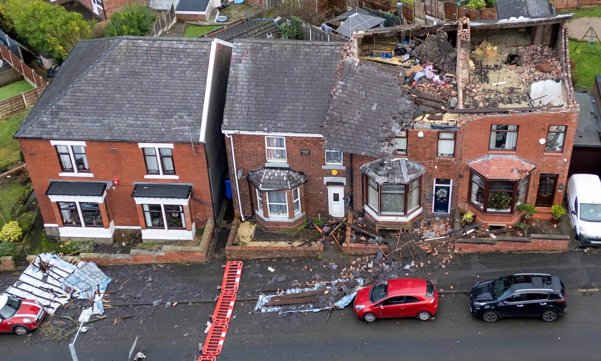 Damage is seen on the roofs of a row of terraced house after Storm Gerrit hit the country in Stalybridge