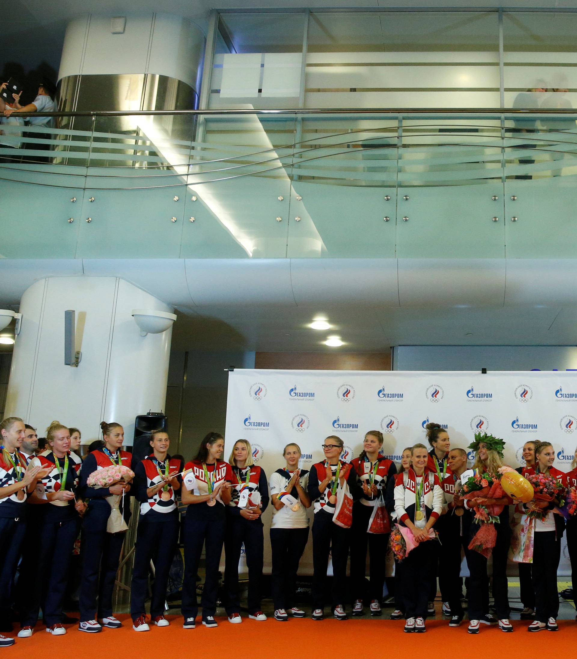 Members of Russian Olympic team attend welcoming ceremony as they return home from 2016 Rio Olympics at Moscow's Sheremetyevo Airport