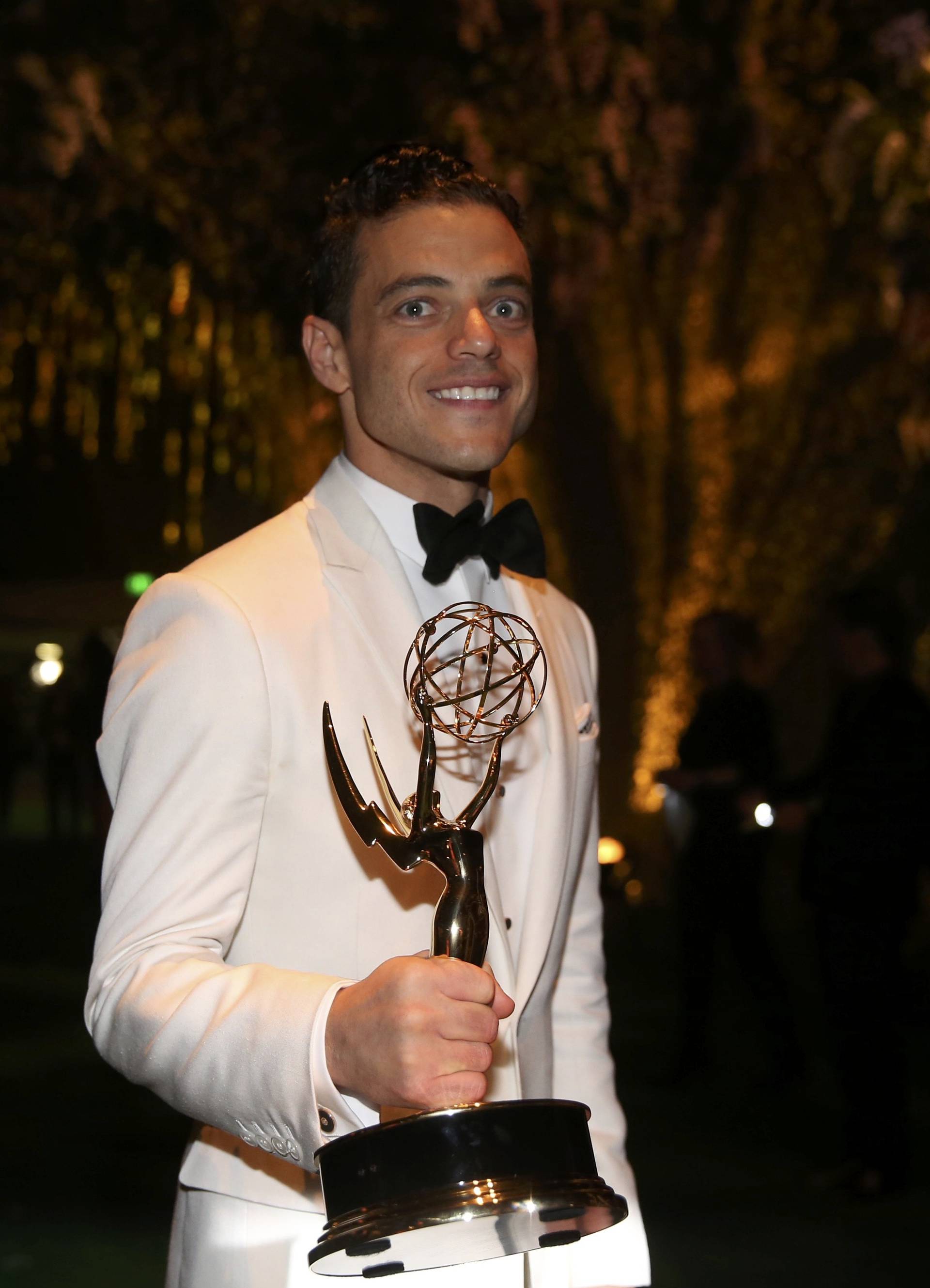 Rami Malek holds his award for Outstanding Lead Actor In A Drama Series as he arrives at the Governors Ball after the 68th Primetime Emmy Awards in Los Angeles