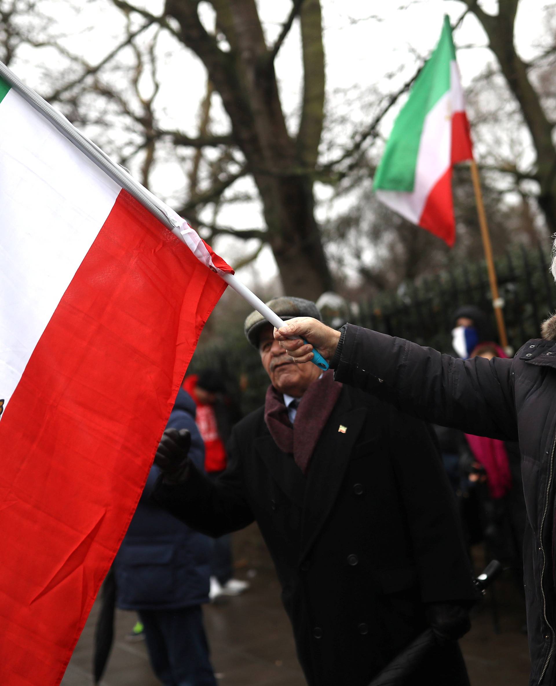 Opponents of Iranian President Hassan Rouhani hold a protest outside the Iranian embassy in west London