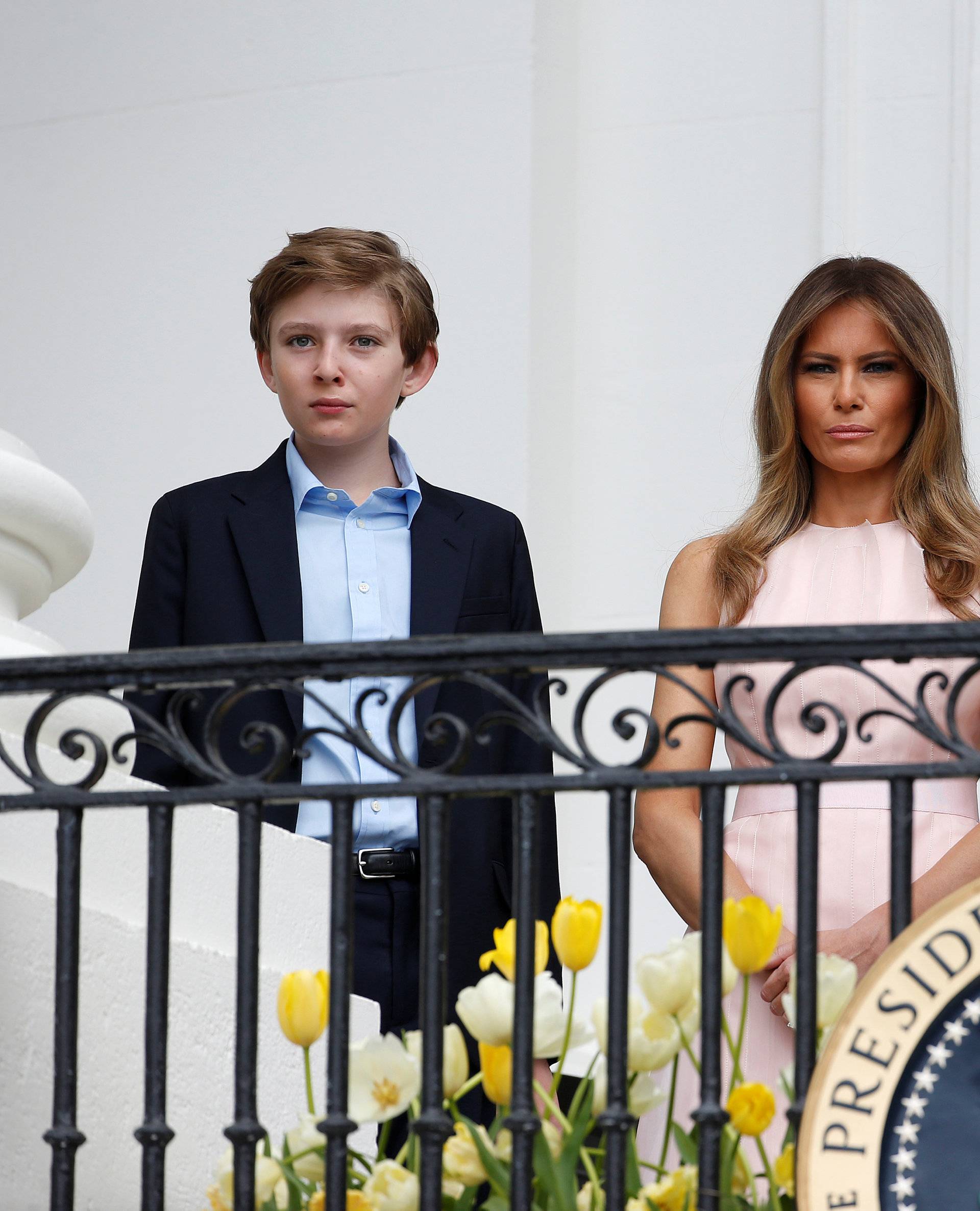 U.S. President Donald Trump speaks as U.S. first lady Melania Trump and their son Barron listen at the 139th annual White House Easter Egg Roll on the South Lawn of the White House in Washington