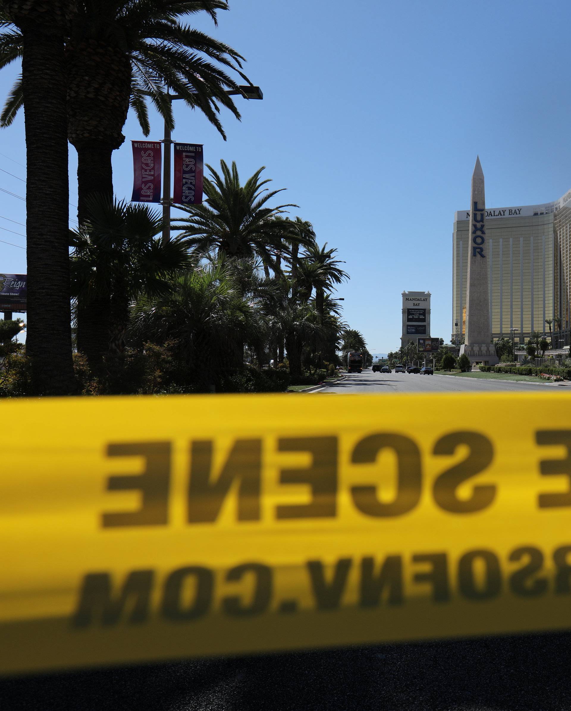 Police crime scene tape marks a perimeter outside the Luxor Las Vegas hotel and the Mandalay Bay Resort and Casino in Las Vegas