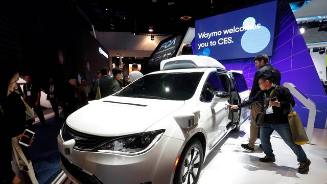 FILE PHOTO: A Waymo autonomous vehicle (formerly the Google self-driving car project) is displayed at the Fiat Chrysler Automobiles booth during the 2019 CES in Las Vegas