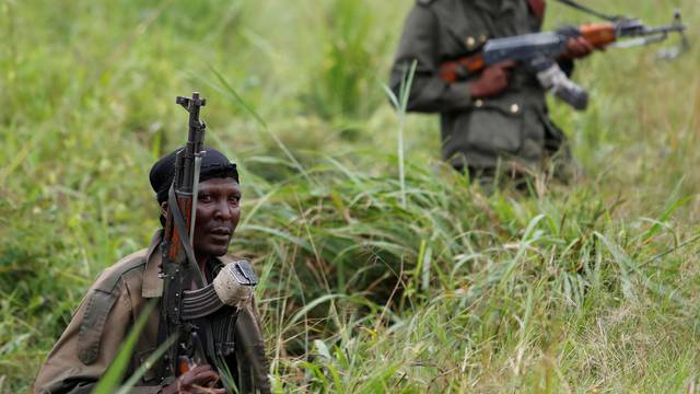 FILE PHOTO: Armed Forces of the Democratic Republic of the Congo (FARDC) soldiers rest next to a road after Islamist rebel group called the Allied Democratic Forces (ADF) attacked area around Mukoko village