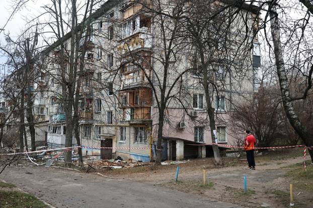 Emergency responders work at the site of a Russian drone strike on an apartment building, in Kyiv