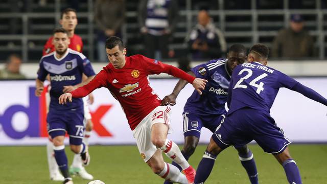 Manchester United's Henrikh Mkhitaryan in action with Anderlecht's Dennis Appiah