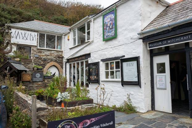 The white washed stone built cottage of the museum of witchcraft and magic in the small fishing village of Boscastle on the north Cornish coast.