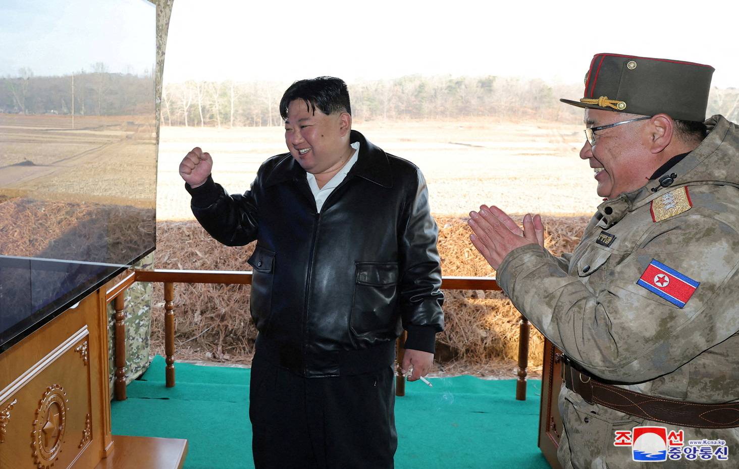 North Korean leader Kim Jong Un guides a training of the fire division