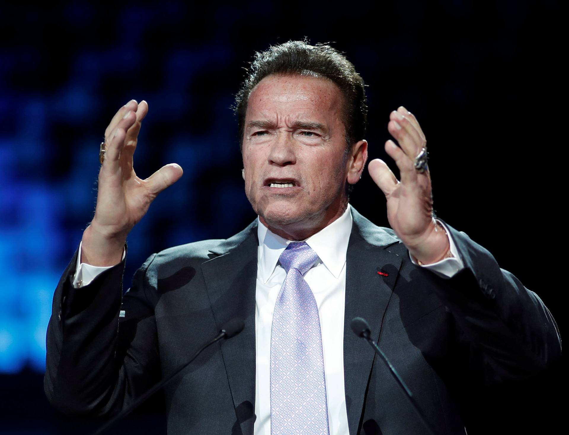 R20 Founder and former California state governor Arnold Schwarzenegger delivers a speech during the One Planet Summit at the Seine Musicale center in Boulogne-Billancourt
