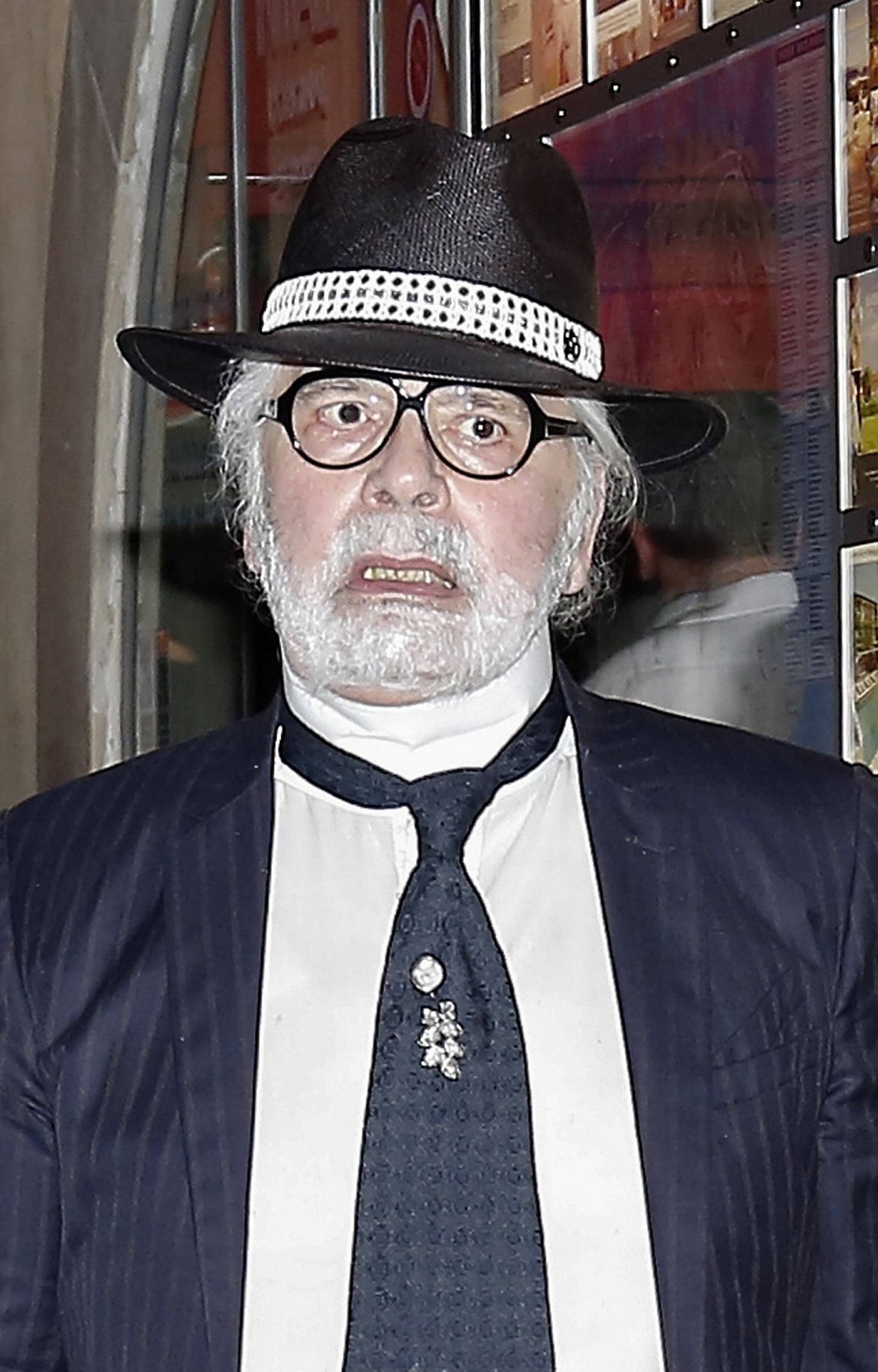 Karl Lagerfeld leaving Le Senequier in Saint Tropez