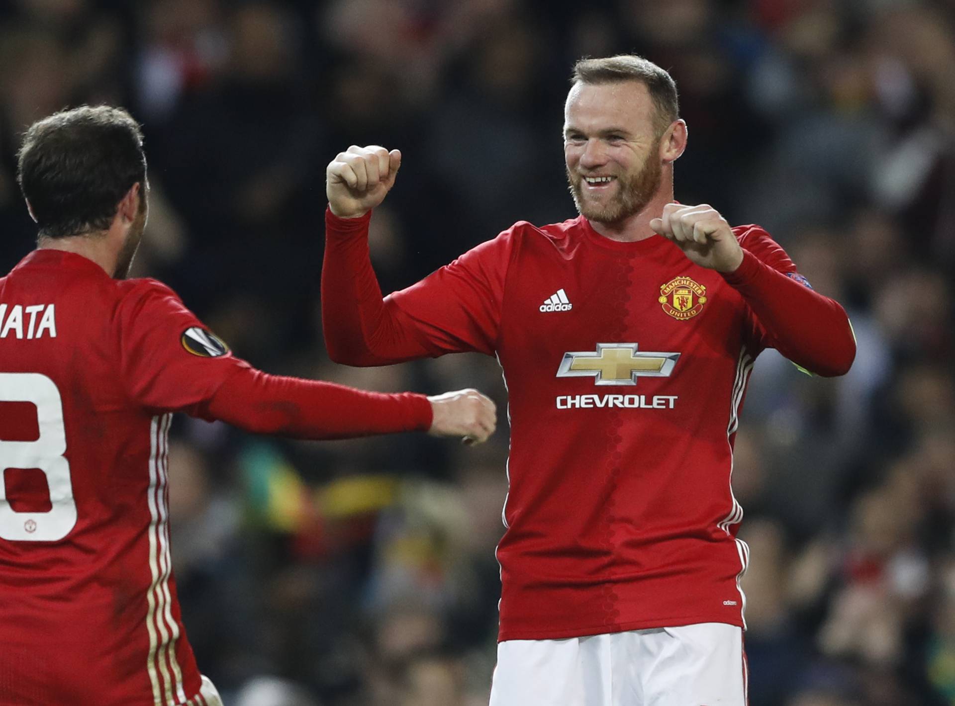 Manchester United's Juan Mata celebrates scoring their second goal  with Wayne Rooney