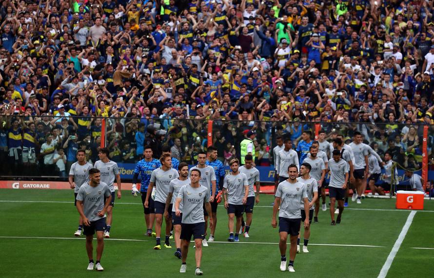 Boca Juniors' players enter the field during a training session open to the public ahead of their second leg Copa Libertadores final match against River Plate in Buenos Aires