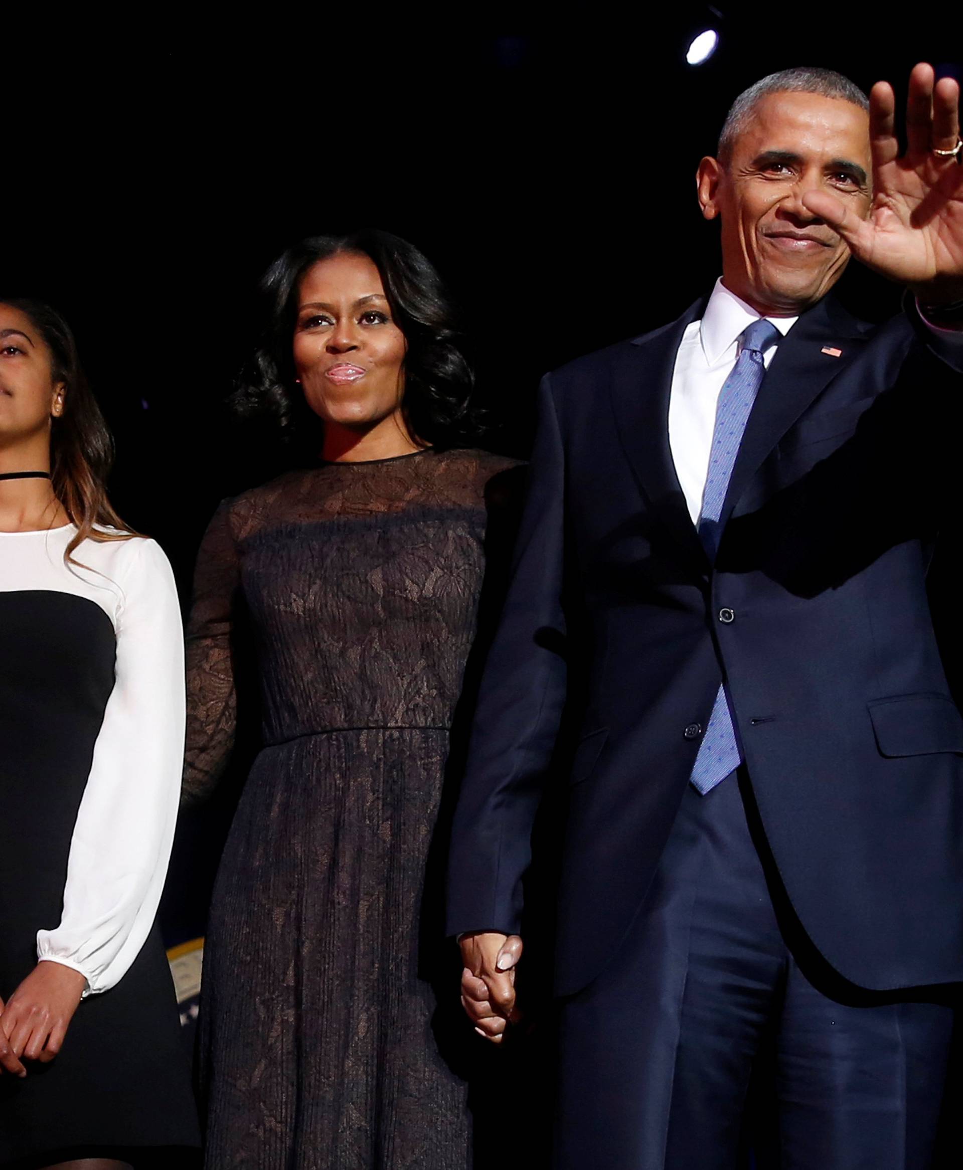 U.S. President Barack Obama is joined onstage by first lady Michelle Obama, Vice President Joe Biden and his wife Jill Biden, after his farewell address in Chicago