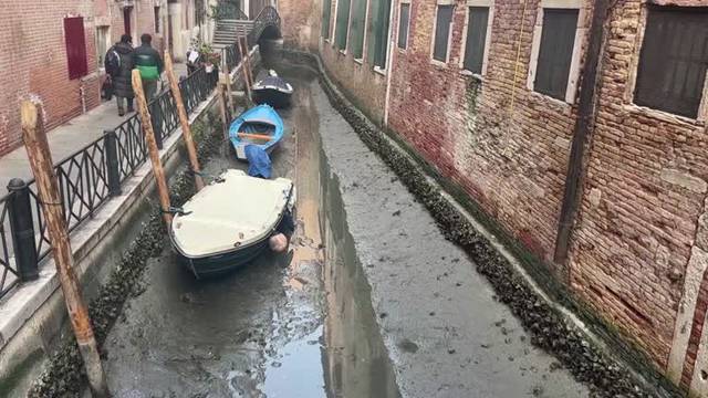 Low tide leaves Venice canals almost dry