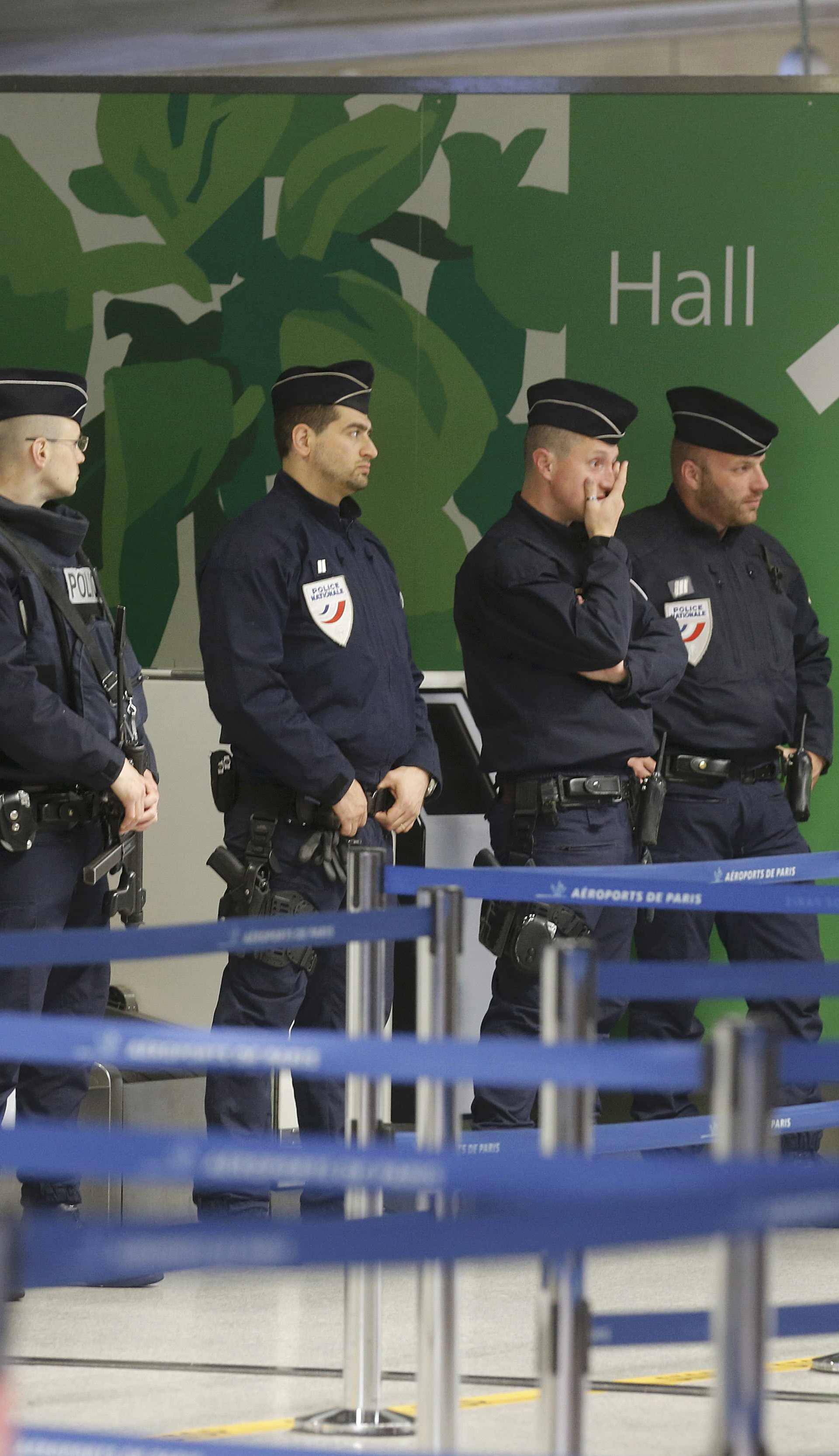 Police take up position at Charles de Gaulle airport in Paris