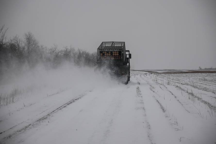 Ukrainian servicemen fire a Grad MLRS towards Russian troops near the frontline town of Chasiv Yar