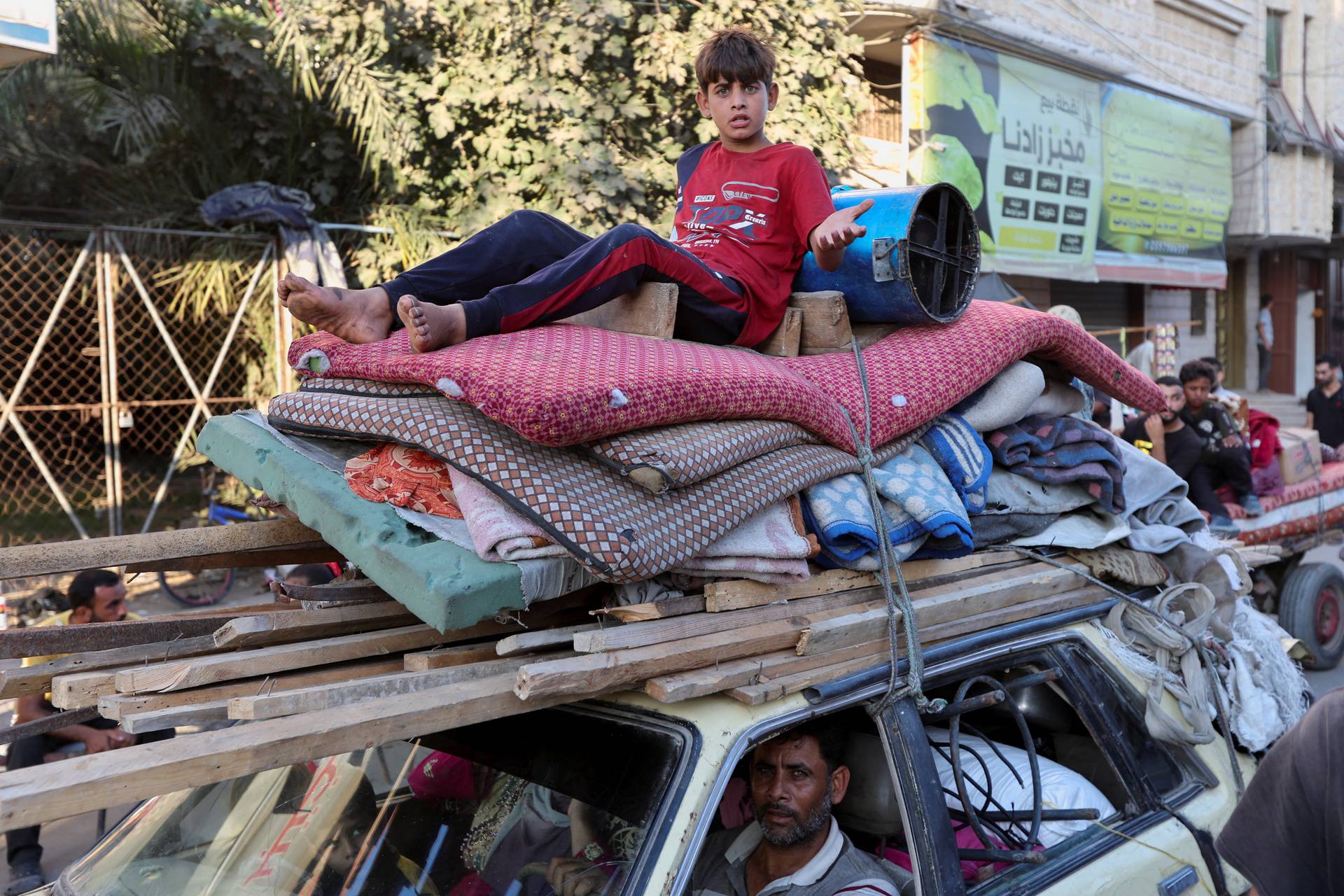 Displaced Palestinians flee in Deir Al-Balah