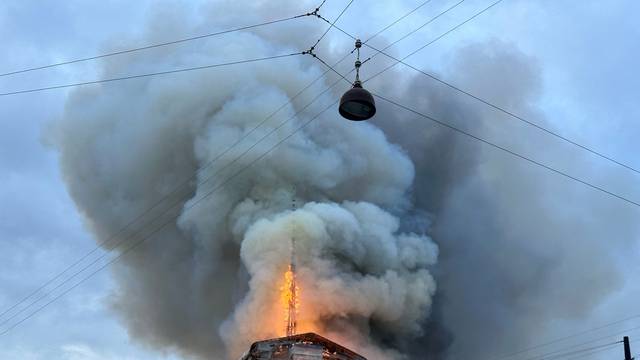 Smoke billows during a fire at the Old Stock Exchange, Boersen, in Copenhagen