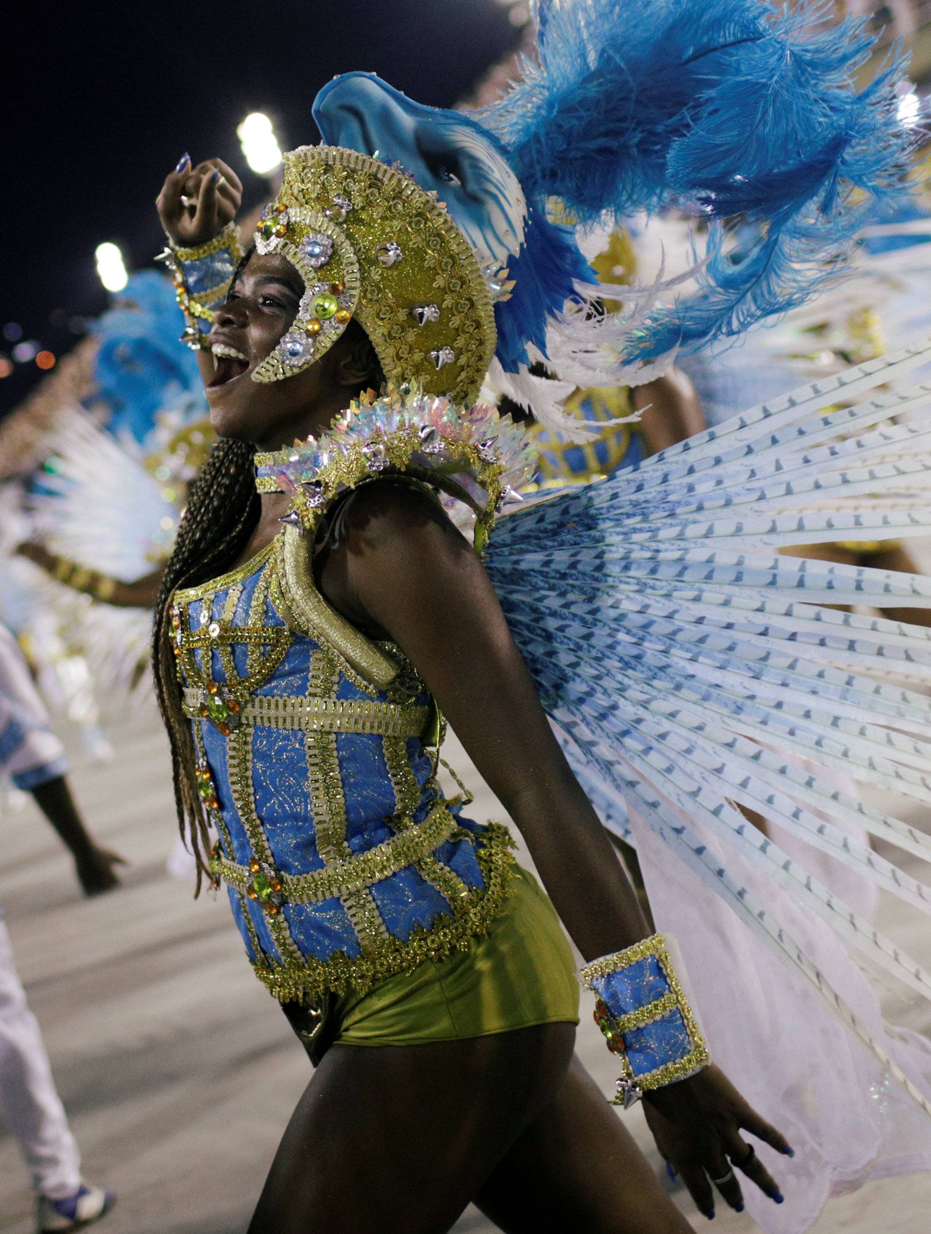 Revellers from Portela Samba school perform during the second night of the Carnival parade at the Sambadrome in Rio de Janeiro