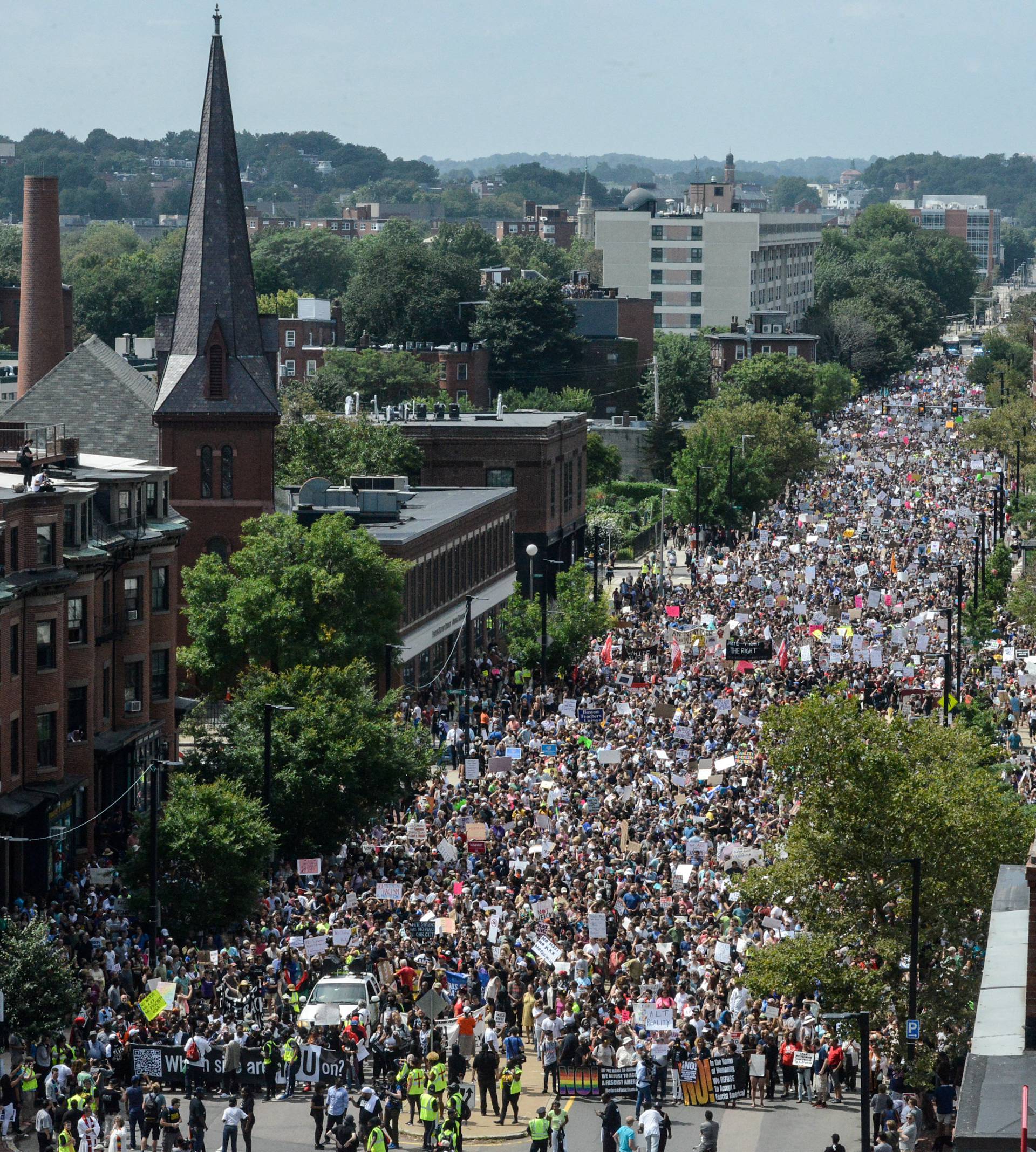 A large crowd of people march towards the Boston Commons to protest the Boston Free Speech Rally in Boston, MA