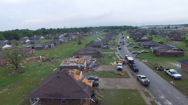 Damaged buildings are seen in the aftermath of a tornado in Monroe